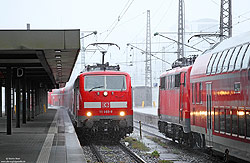111 065 im Starkregen bei der Einfahrt in München Hbf