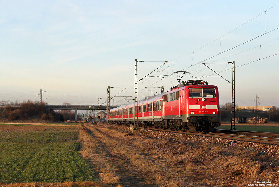 111 030 vom Bw Ludwigshafen mit der RB38861 Ludwigshafen – Karlsruhe südlich von Graben Neudorf