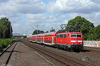 Noch bis Dezember 2015 wird der RE7 von DB-Regio gefahren, bevor hier neue Triebwagen von National Express zum Einsatz kommen. Am Vormittag des 31.7.2015 fährt die 111 149 mit dem RE26112 bei Schwelm West nach Rheine.